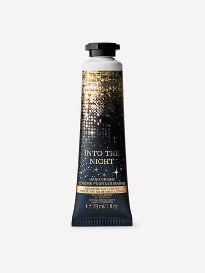 Cremă pentru mâini Into the Night Bath & Body Works cu motiv de stele aurii și cer nocturn