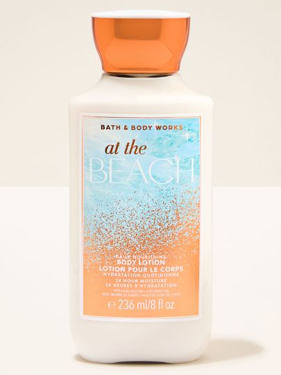Loțiune de corp At the Beach Bath & Body Works într‑o sticlă deschisă cu capac portocaliu