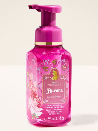 Săpun spumant Aurora de la Bath & Body Works, în flacon roz cu motive florale și accente aurii.