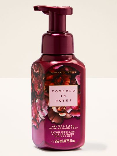 Spumă roz pentru mâini „Covered in Roses” în flacon decorat cu trandafiri.