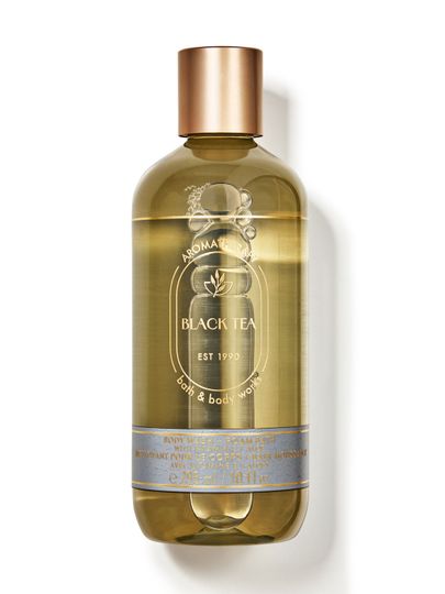 Gel de duș și spumant de baie Bath & Body Works Aromatherapy "Black Tea" în sticlă transparentă.