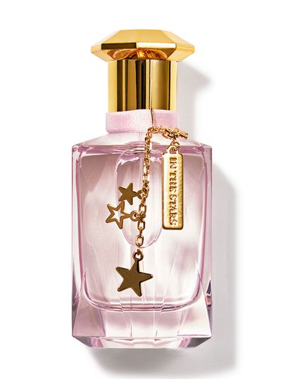 Parfém „In the Stars“ v růžové lahvičce se zlatým uzávěrem a přívěskem, Bath & Body Works.