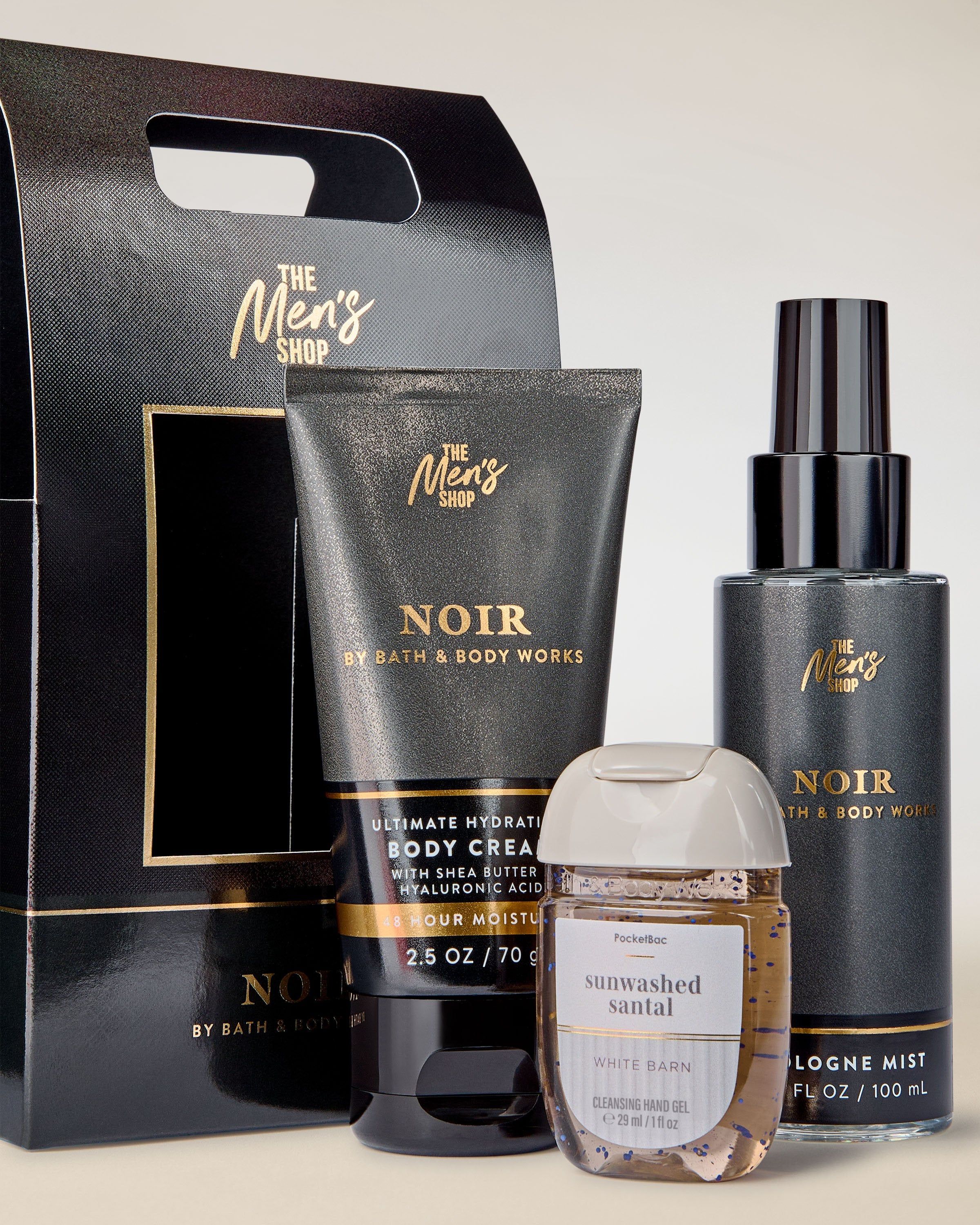 Set The Men’s Shop Noir de la Bath & Body Works cu cremă de corp și mgiełcă, plus gel antibacterian White Barn.