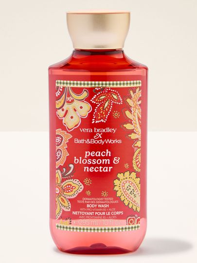 Bath & Body Works Peach Blossom & Nectar – gel de duș într-un flacon decorat cu motiv floral și de piersici.