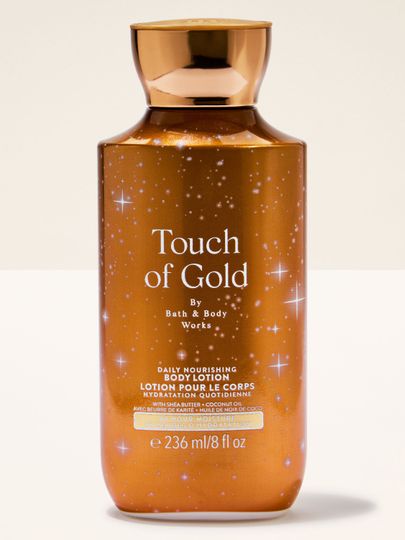 Loțiune de corp Touch of Gold de la Bath & Body Works, în sticlă aurie, cu formulă hidratantă și luminoasă.
