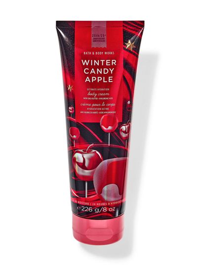 Červený tělový krém s motivem červených, kandovaných jablek, vytvořený k 25. výročí. Bath & Body Works.