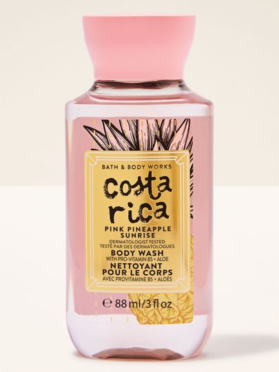 Gel de duș mini Costa Rica Pink Pineapple Sunrise în sticlă roz, cu etichetă tropicală și capac roz.