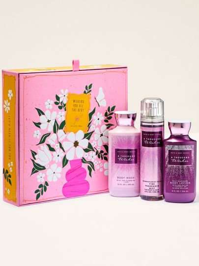 Set cadou Bath & Body Works A Thousand Wishes cu spray parfumat, gel de duș și loțiune de corp, în cutie decorativă.