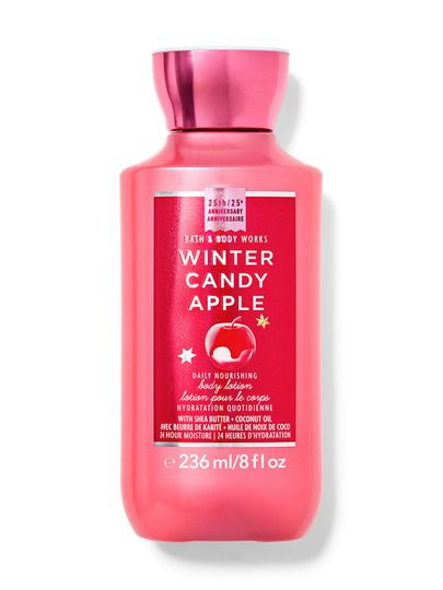 Růžové tělové mléko s motivem jablka a nápisem "Winter Candy Apple", Bath & Body Works.