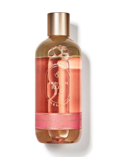 Gel de duș și spumant de baie Bath & Body Works Aromatherapy "Heirloom Rose" în sticlă cu lichid roz.