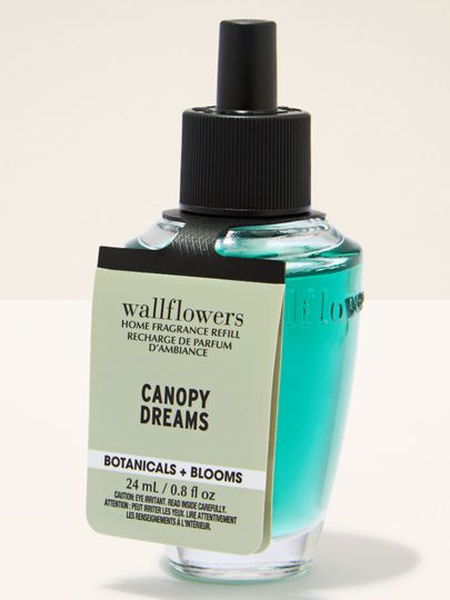 Rezervele parfumate Wallflowers Canopy Dreams, într-o sticluță de sticlă, compatibile cu difuzorul cu priză pentru o aromatizare de durată a încăperilor.