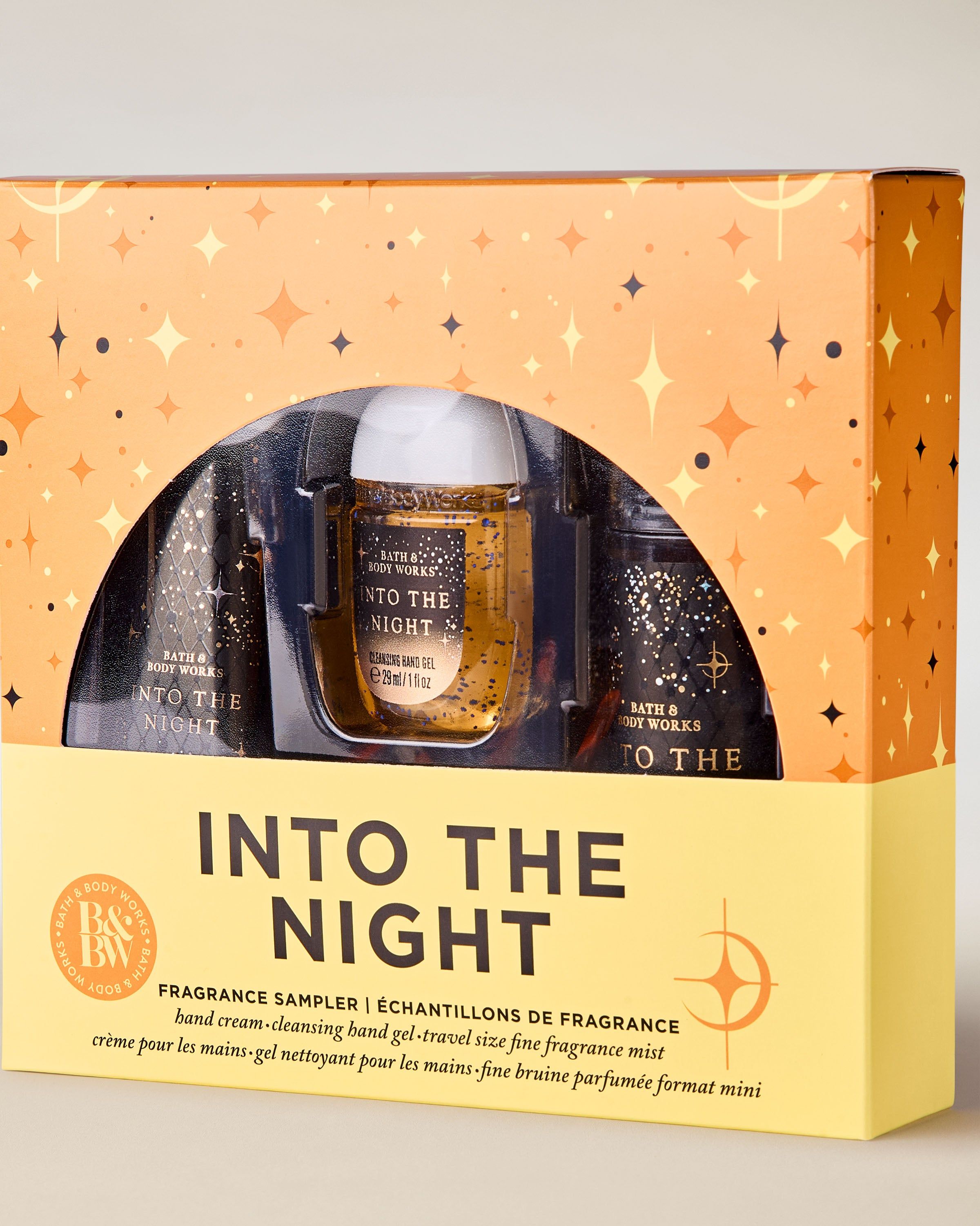 Setul Into the Night de la Bath & Body Works în cutie negru‑aurie – gel, cremă și spray mini.
