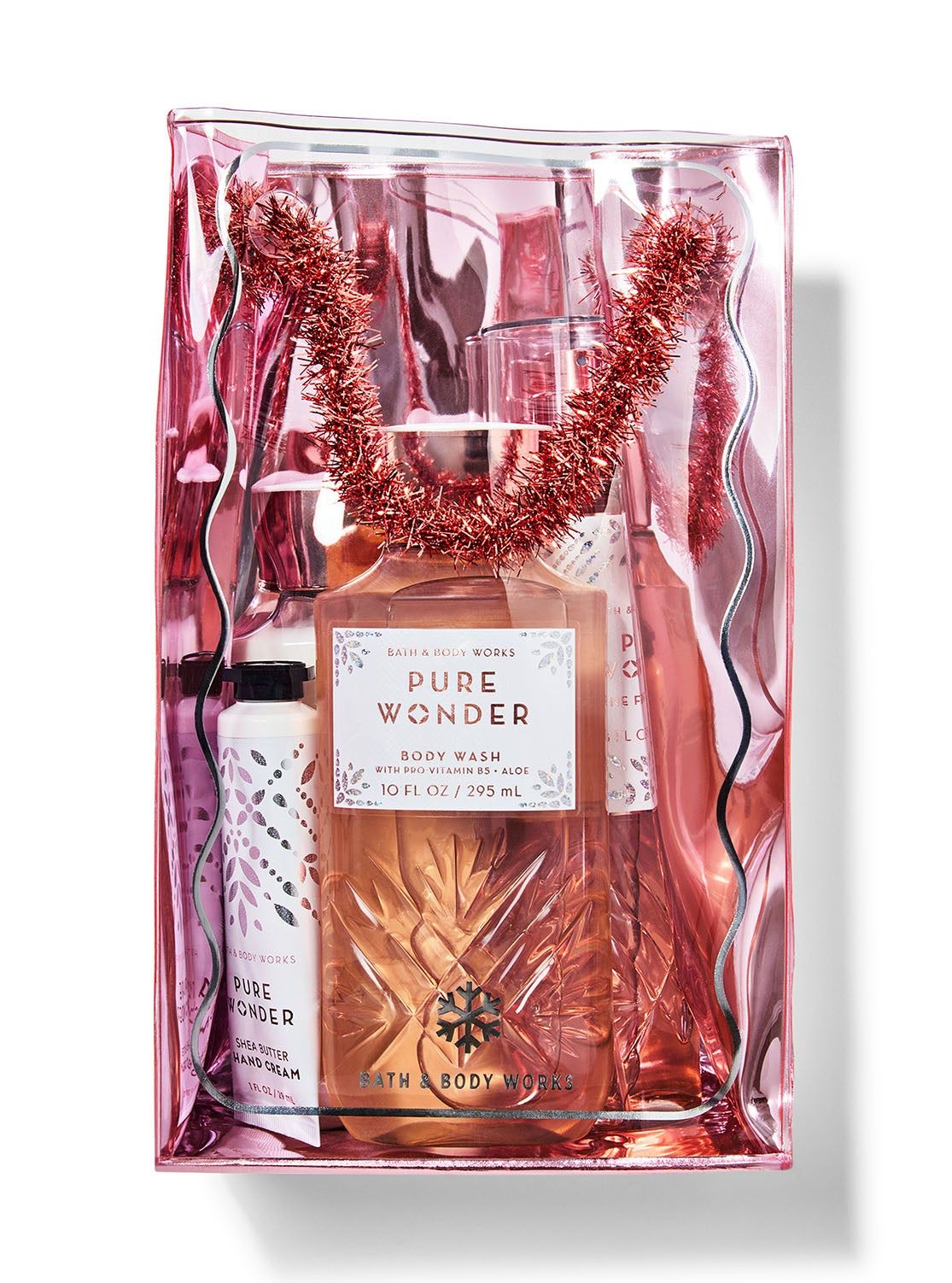 Dárková sada „Pure Wonder” v průhledné růžové kosmetické taštičce s ozdobnou girlandou, Bath & Body Works.