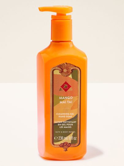 Săpun gel Bath & Body Works Mango Mai Tai în sticlă portocalie cu etichetă tropicală.