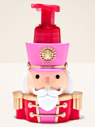 Dozator pentru săpun Bath & Body Works în formă de spărgător de nuci cu uniformă roșu-roz