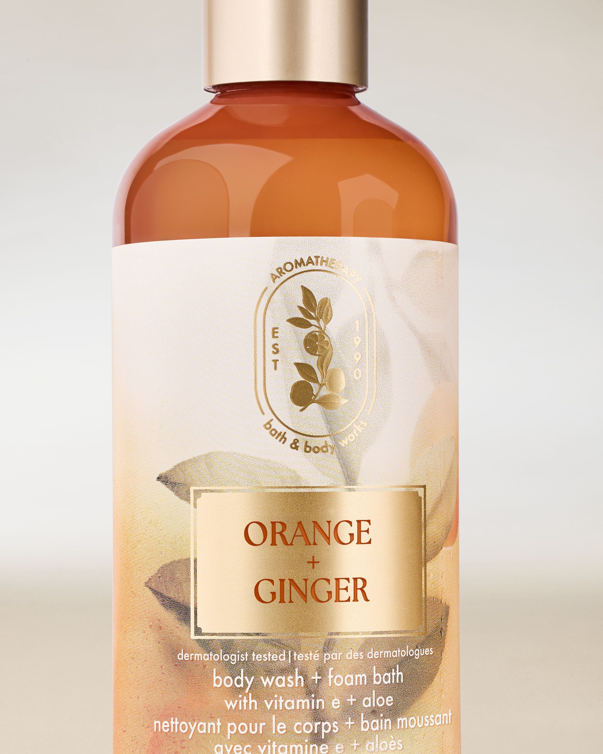 Gel de duș Bath & Body Works Aromatherapy Orange + Ginger 295 ml, în flacon portocaliu cu capac.