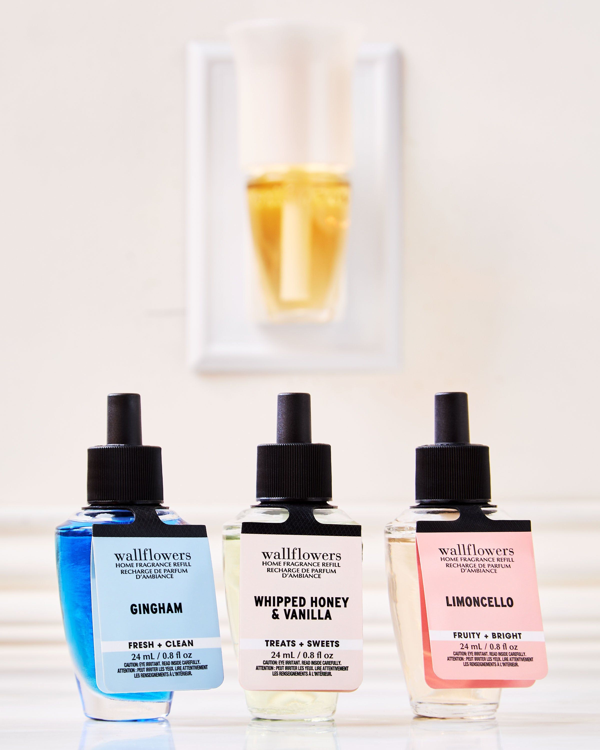 Set de reumpleri Wallflowers: Gingham, Whipped Honey & Vanilla și Limoncello în sticluțe elegante.