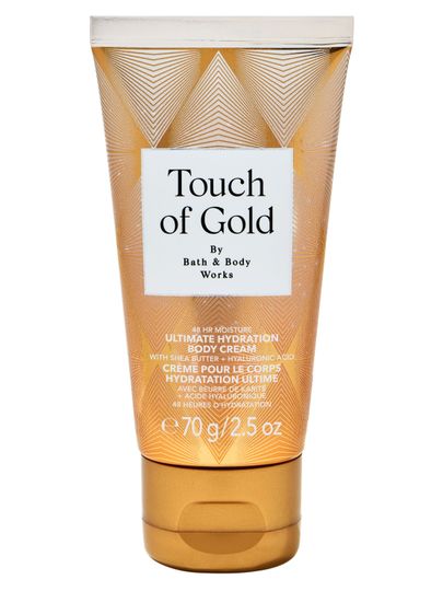 Cremă de corp mini Touch of Gold de la Bath & Body Works în tub auriu, cu formulă intens hidratantă.