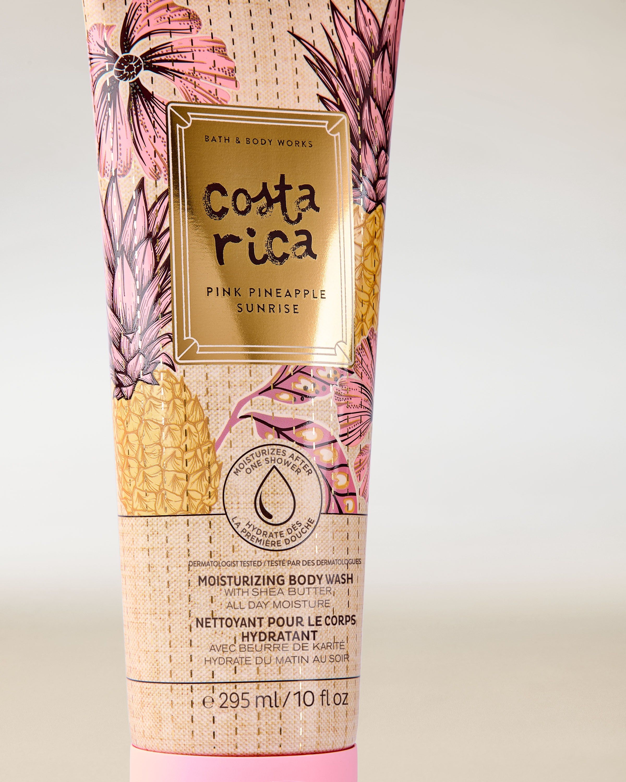 Gel de duș hidratant Costa Rica Pink Pineapple Sunrise în tub cu grafică tropicală și accente roz.