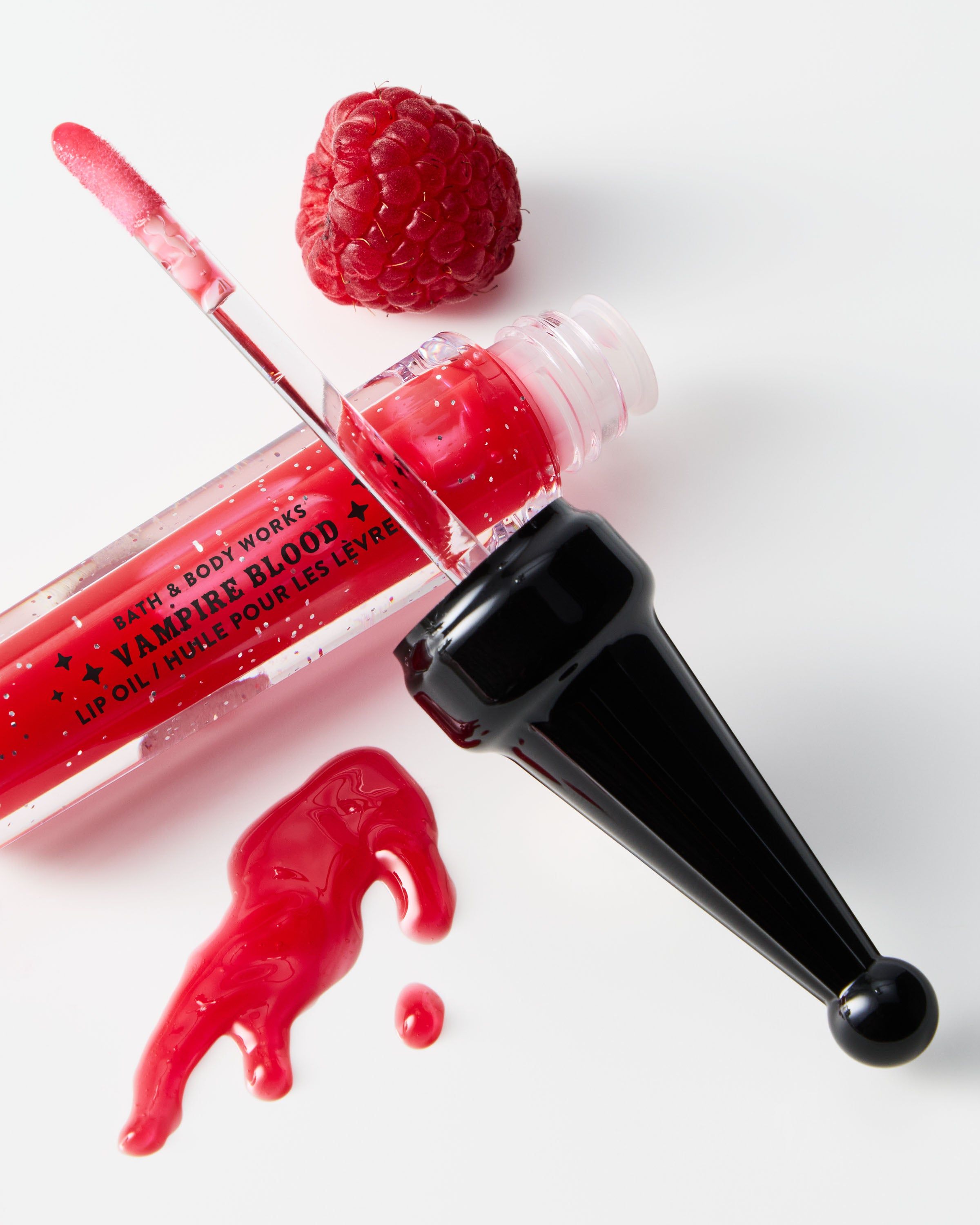 Luciu de buze Bath & Body Works Vampire Blood cu particule strălucitoare