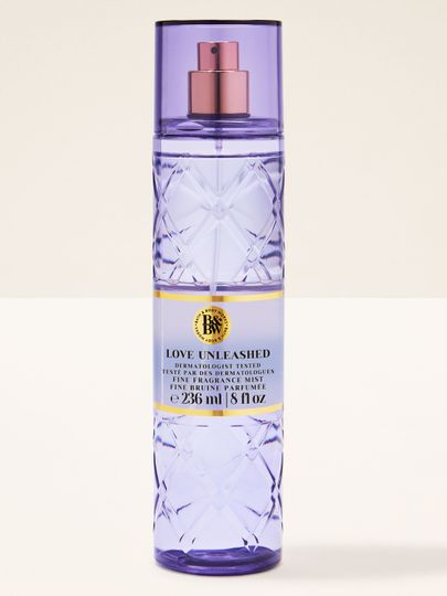 Bath & Body Works Love Unleashed – spray lila în sticlă texturată cu pulverizator roz‑auriu.
