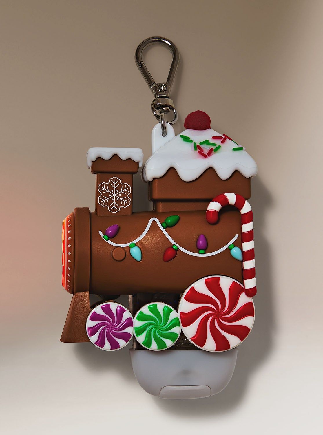 Vánoční pouzdro na gel na ruce ve tvaru perníkového vláčku, ozdobené bonbony, Bath & Body Works.
