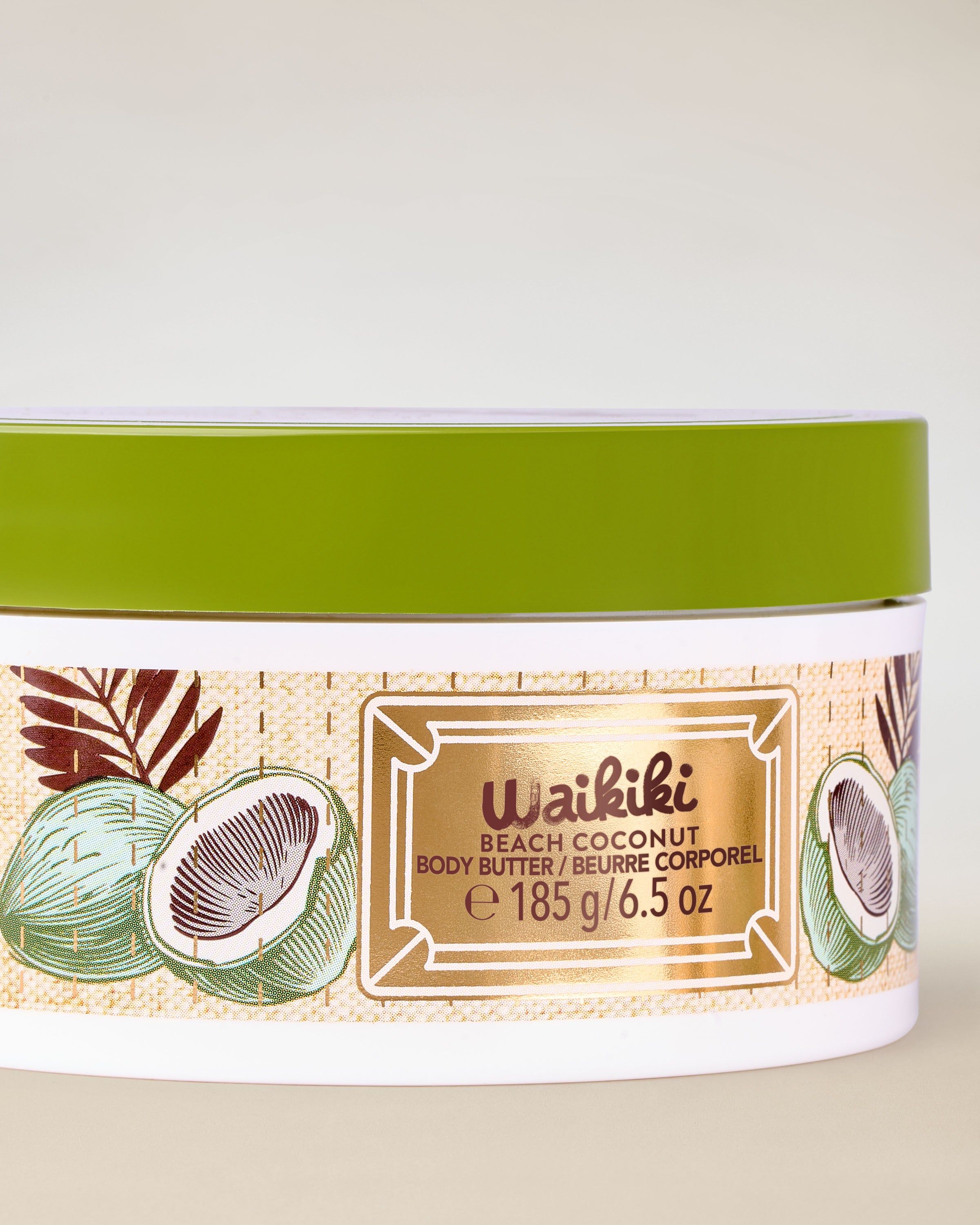 Unt de corp Bath & Body Works Waikiki Beach Coconut cu motiv cocos și capac verde.
