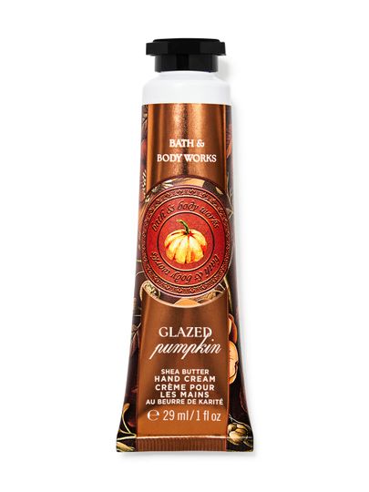 Cremă de mâini Bath&Body Works Glazed Pumpkin. Tub mic, metalic, portocaliu-maroniu, cu un dovleac și inscripții.