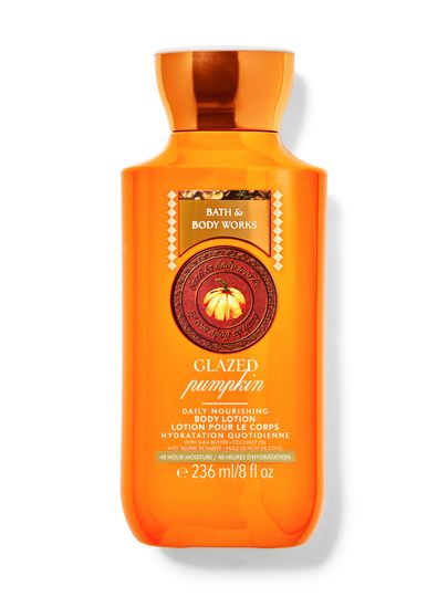 Balsam de corp Bath&Body Works Glazed Pumpkin. Sticlă portocalie din plastic cu capac portocaliu și etichetă cu un dovleac.