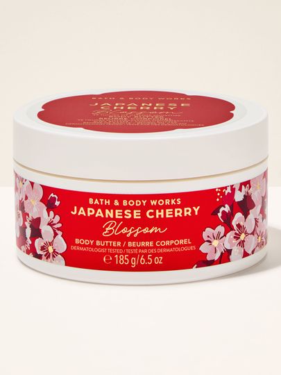 Unt de corp Bath & Body Works "Japanese Cherry Blossom" în borcan alb rotund cu etichetă roșie cu flori.