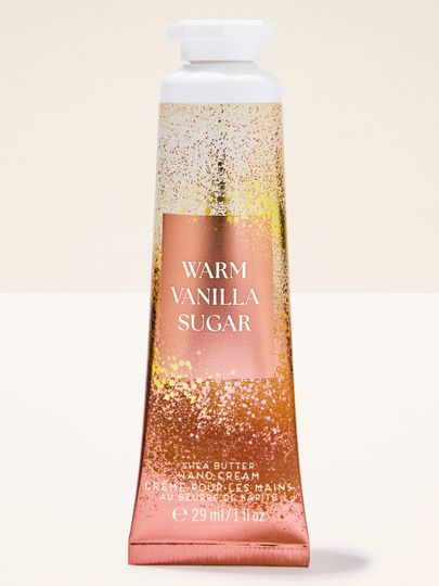 Cremă de mâini Bath & Body Works Warm Vanilla Sugar în tub auriu‑vanilie, 29 ml.