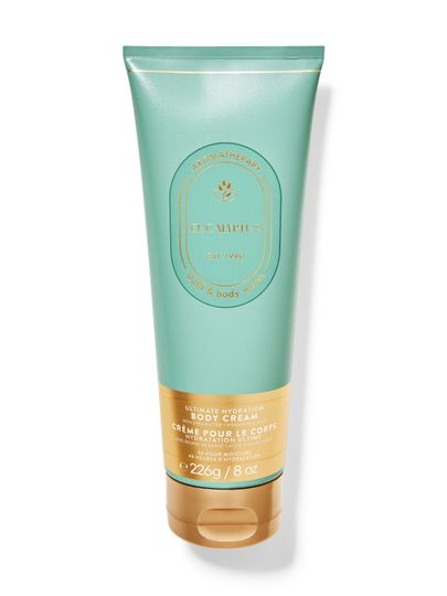 Cremă de corp Bath & Body Works Aromatherapy "Eucalyptus" în tub turcoaz cu scris și capac aurii.