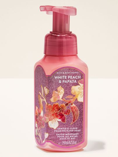 Spumă pentru mâini Bath & Body Works „White Peach & Papaya” — sticlă roz cu flori.