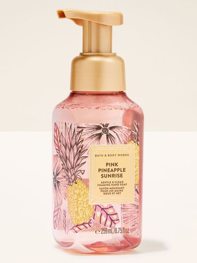 Pink Pineapple Sunrise – săpun spumant roz cu pompă aurie și etichetă tropicală cu ananas.