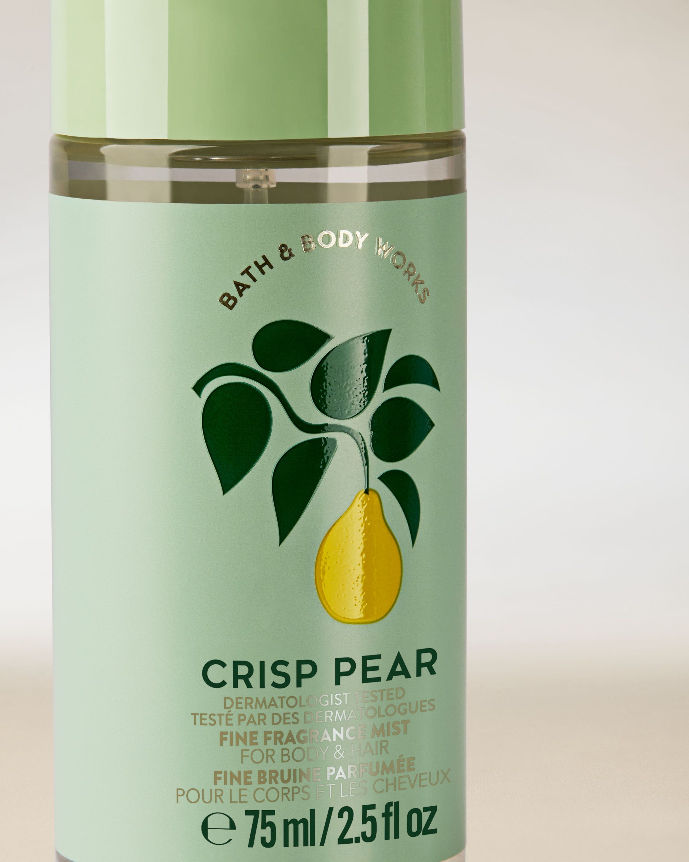 Ceață parfumată pentru corp și păr Crisp Pear într‑o sticlă verde