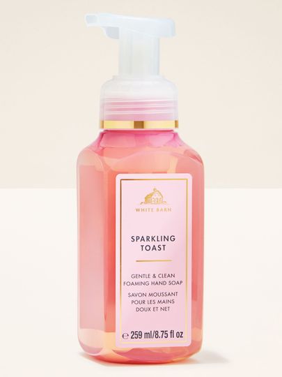 Spumă de mâini Sparkling Toast Bath & Body Works în sticlă roz cu pompiță albă și etichetă aurie