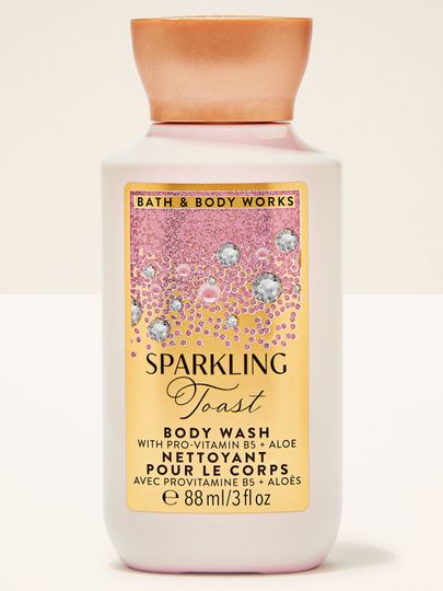 Gelul de duș mic Sparkling Toast Bath & Body Works în sticluță cu etichetă roz‑aurie