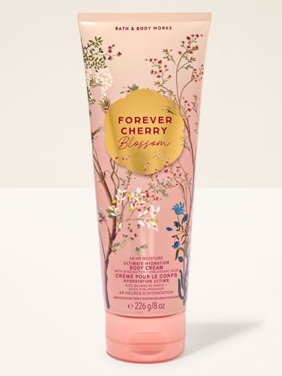 Cremă de corp Bath & Body Works Forever Cherry Blossom 226 g, în tub roz deschis cu decor floral.