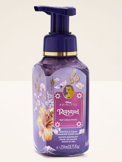 Săpun spumant Rapunzel în flacon mov cu motive florale și accente aurii de poveste.