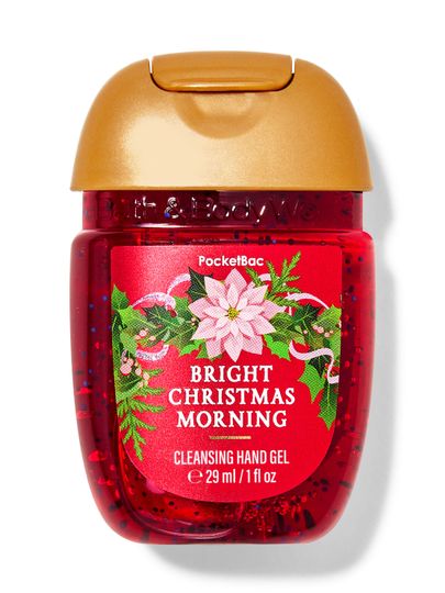 Cestovní čisticí gel na ruce „Bright Christmas Morning“ v červeném obalu s vánoční hvězdou. Bath & Body Works.