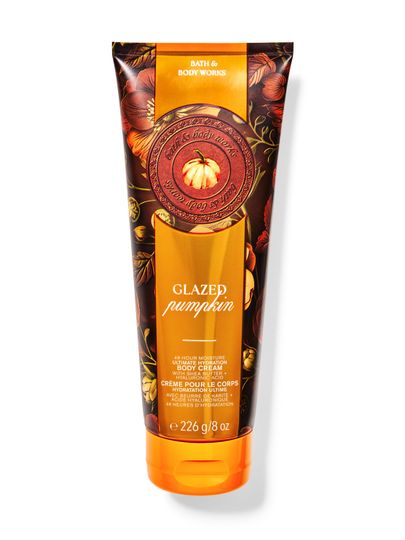 Cremă de corp Bath&Body Works Glazed Pumpkin. Tub mare, metalic, portocaliu-maroniu, cu un dovleac și inscripții.