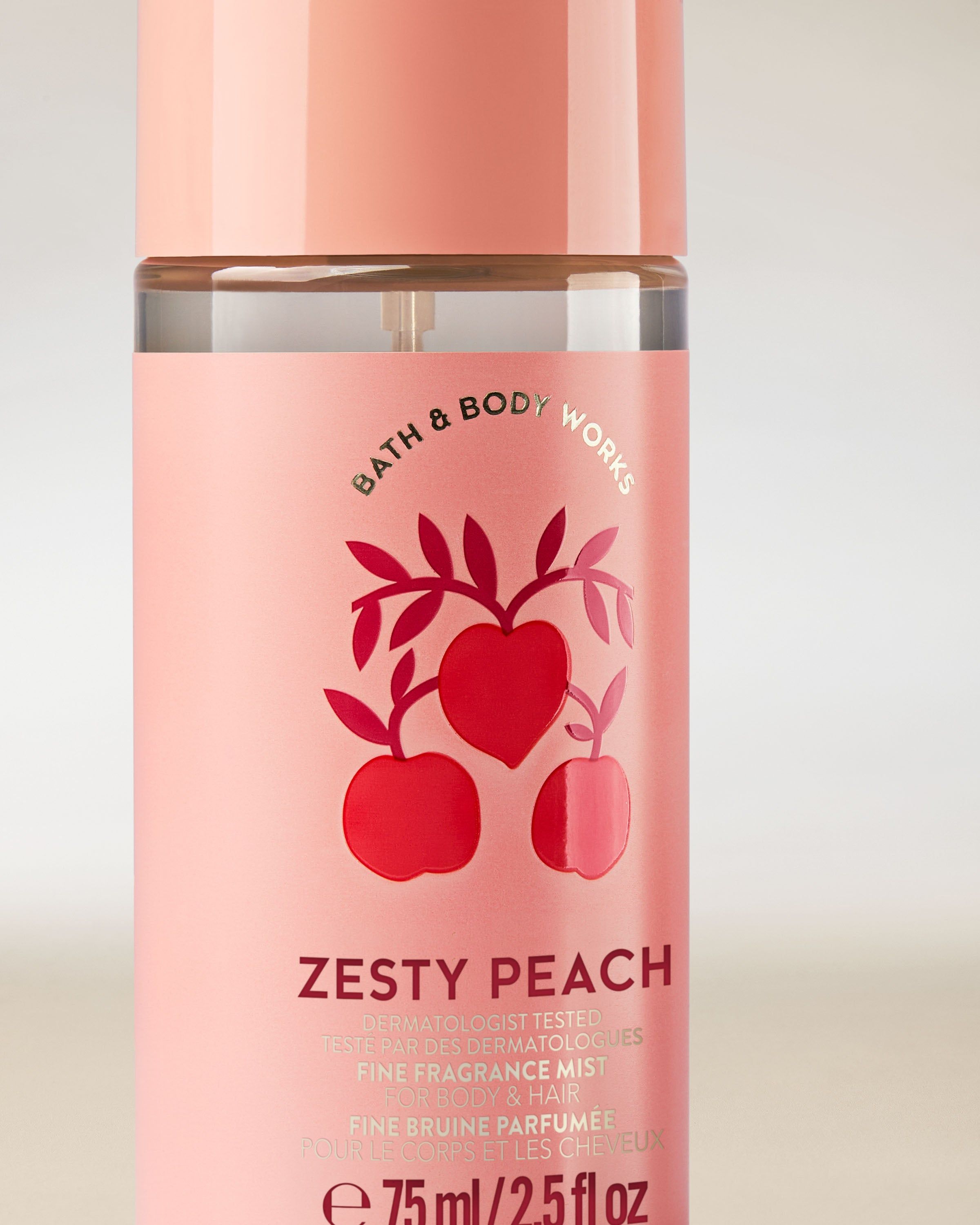 Ceață parfumată pentru corp și păr Zesty Peach într‑o sticlă roz