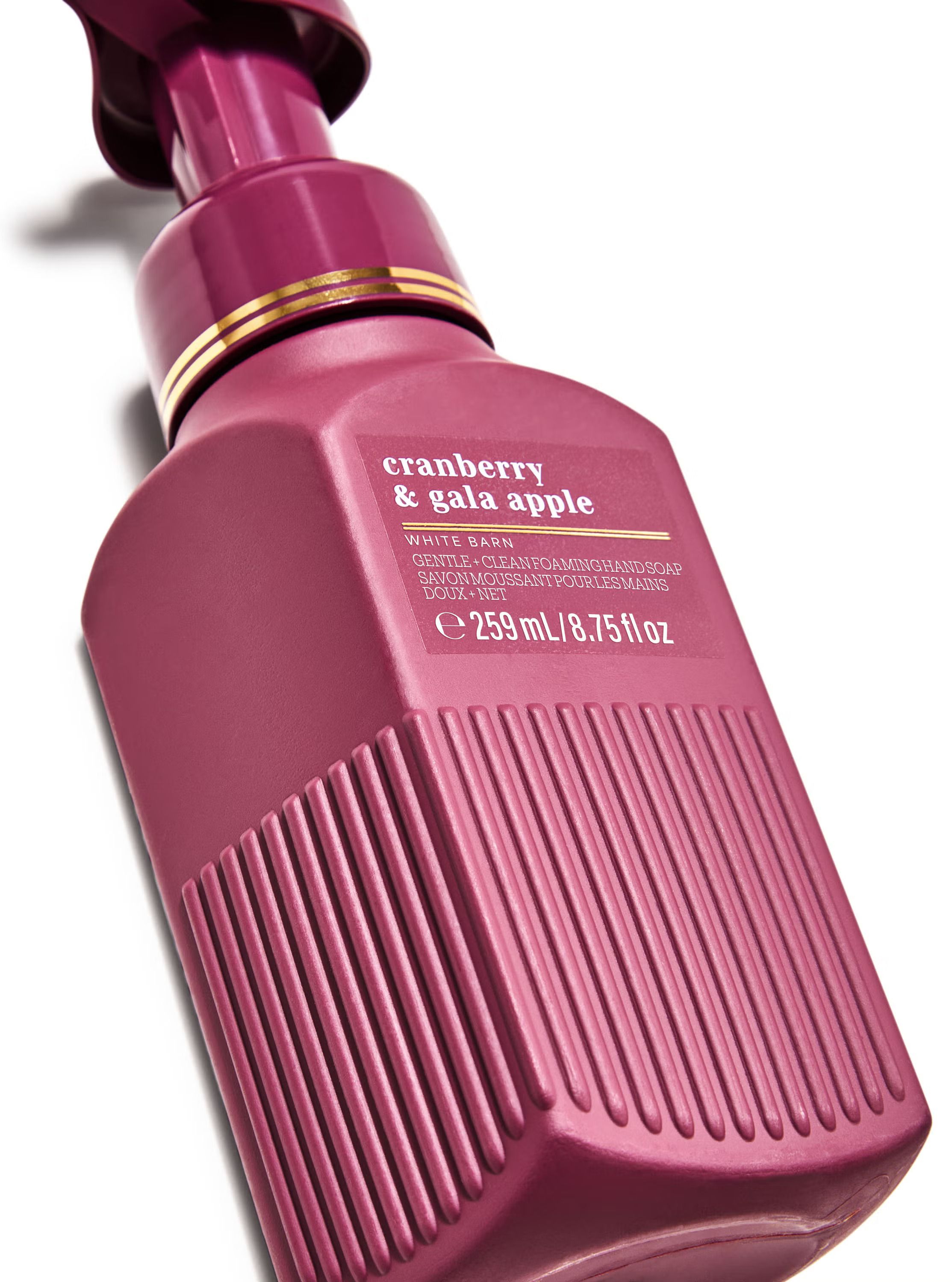 Săpun spumant Cranberry & Gala Apple în ambalaj bordo, oferind o prospețime fructată.
