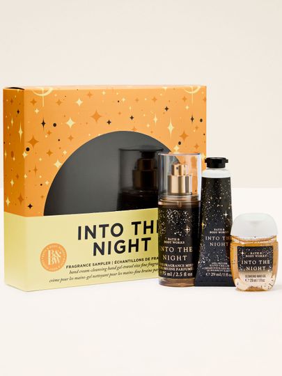 Setul Into the Night de la Bath & Body Works în cutie negru‑aurie – spray, cremă și gel antibacterian.